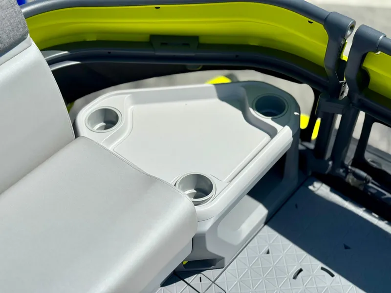 Slide: The Image of 2024 Sea-Doo Switch® Cruise 21 interior with cup holders and seating, featuring a modern design. - 12