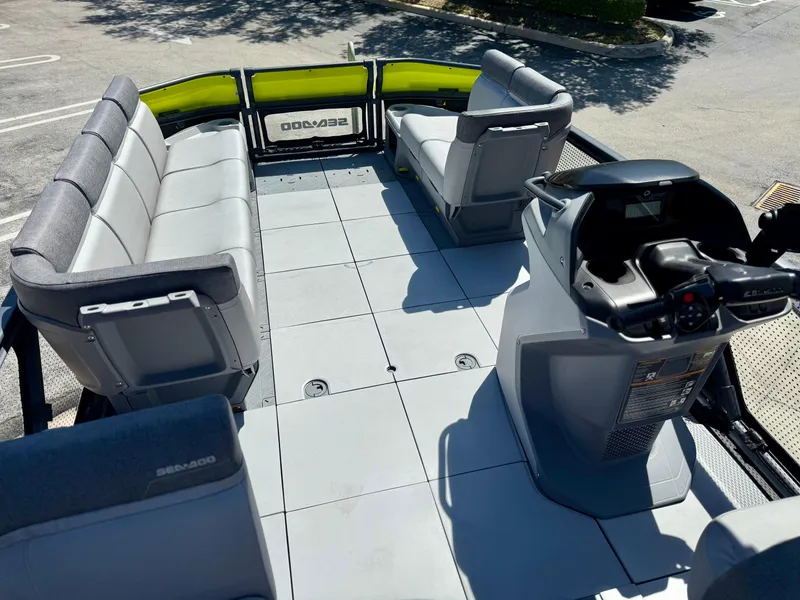 Slide: The Image of 2024 Sea-Doo Switch® Cruise 21 boat interior with spacious seating and modern helm. - 7