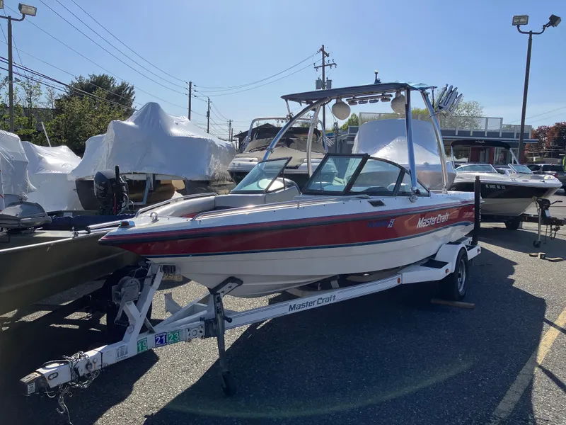 Slide: The Image of 1993 MasterCraft Prosport 205 boat on trailer in outdoor lot. - 2