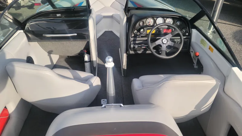 Slide: The Image of 1993 MasterCraft Prosport 205 boat interior with steering wheel and seating. - 5