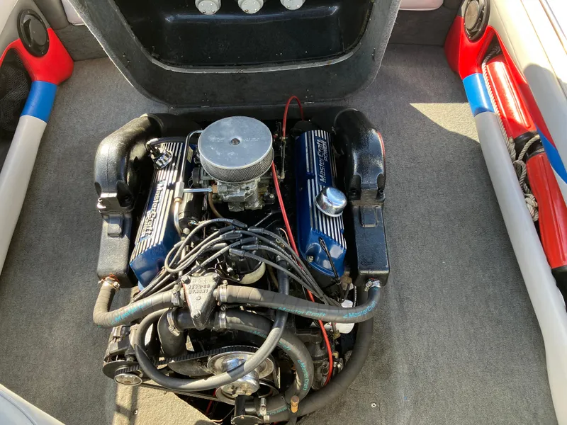 Slide: The Image of 1993 MasterCraft Prosport 205 engine compartment with visible components and wiring. - 8
