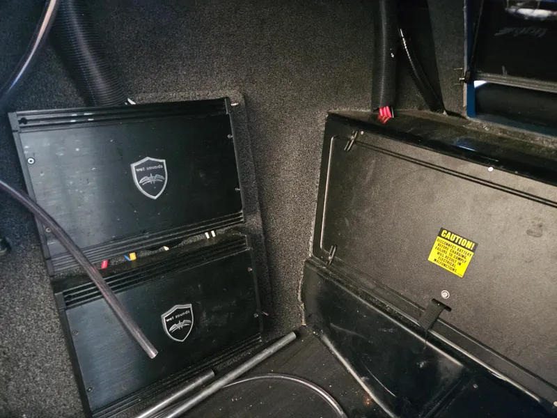 Slide: The Image of 2020 Tigé ZX25 interior showing audio equipment and wiring setup. - 11