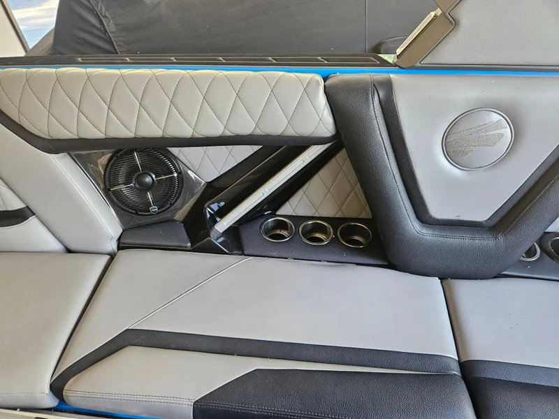 Slide: The Image of 2020 Tigé ZX25 interior with quilted seats, cup holders, and speaker detail. - 12