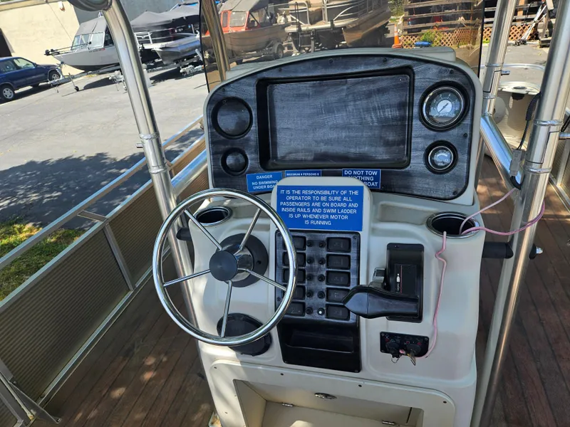 Slide: The Image of 2020 Tigé ZX25 boat dashboard with steering wheel and control panel. - 17