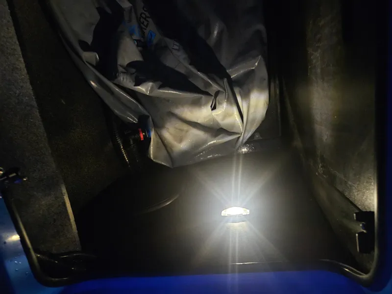 Slide: The Image of 2020 Tigé ZX25 boat interior storage compartment with light and cover. - 26
