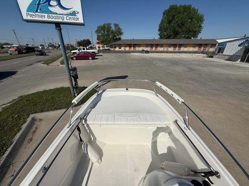 Slide: The Image of 2009 Boston Whaler 130 Super Sport boat at Premier Boating Center parking lot. - 9