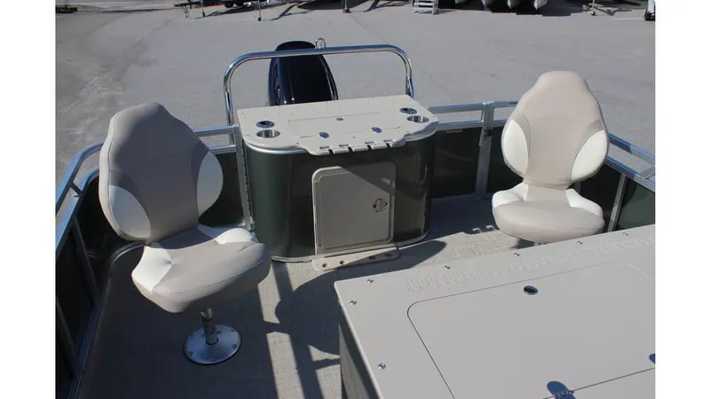 Slide: The Image of 2025 Tahoe Sport 85 Rear Fish 23 SW boat interior with swivel seats and control panel. - 10