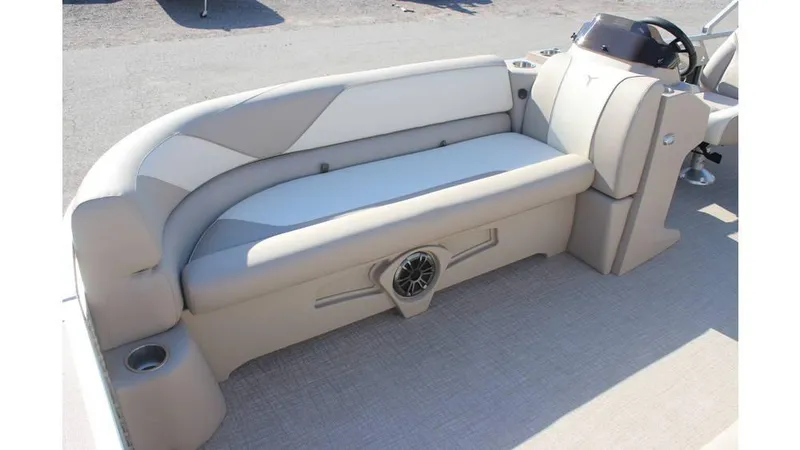 Slide: The Image of 2025 Tahoe Sport 85 Rear Fish 23 SW boat interior with beige seating and speaker. - 15