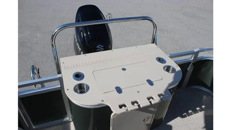 Slide: The Image of 2025 Tahoe Sport 85 Rear Fish 23 SW boat deck with motor and fishing setup. - 17