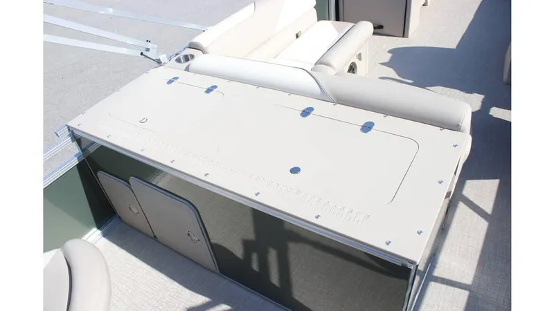 Slide: The Image of 2025 Tahoe Sport 85 Rear Fish 23 SW boat interior with storage compartment and seating. - 19