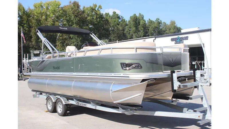 Slide: The Image of 2025 Tahoe Sport 85 Rear Fish 23 SW pontoon boat on trailer, outdoors. - 5