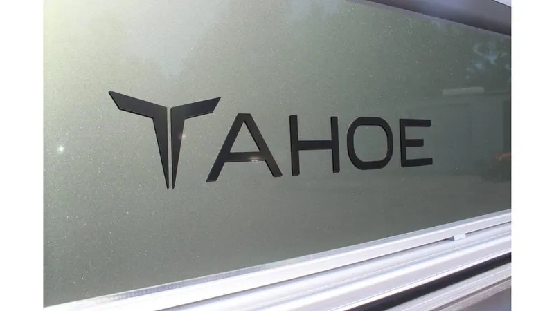 Slide: The Image of 2025 Tahoe Sport 85 Rear Fish 23 SW logo on metallic surface. - 7