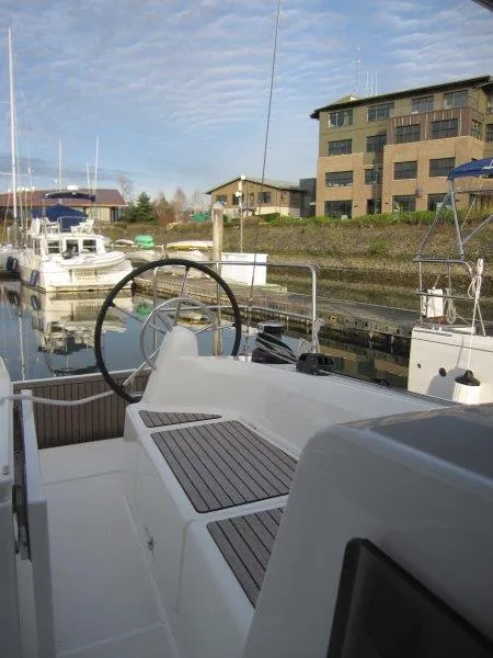 Slide: The Image of 2024 Jeanneau Sun Odyssey 410 docked, showcasing sleek design and modern features. - 25