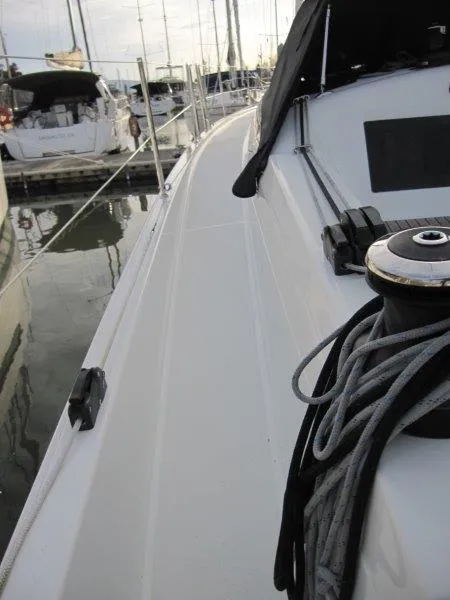 Slide: The Image of 2024 Jeanneau Sun Odyssey 410 sailboat deck with ropes, docked at marina. - 30