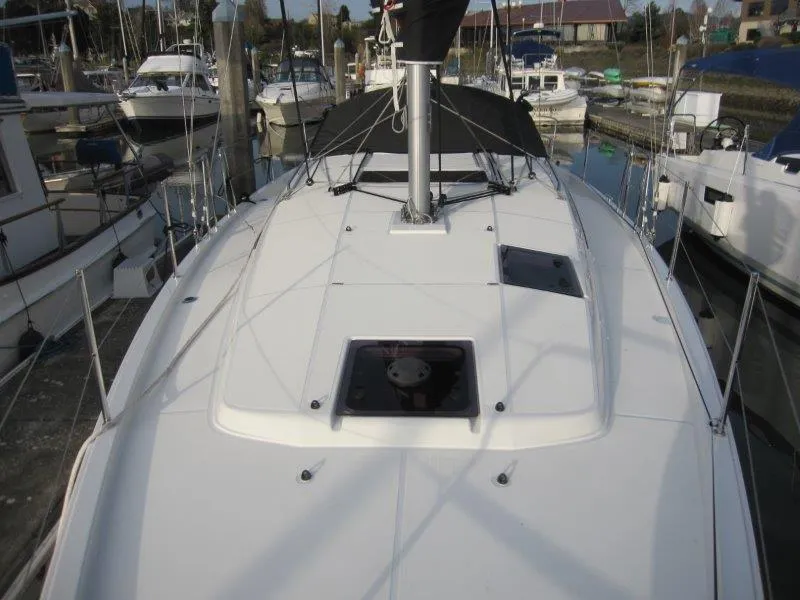 Slide: The Image of 2024 Jeanneau Sun Odyssey 410 sailboat deck view at marina. - 35