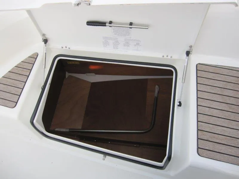 Slide: The Image of Open storage compartment on 2024 Jeanneau Sun Odyssey 410 sailboat deck. - 37