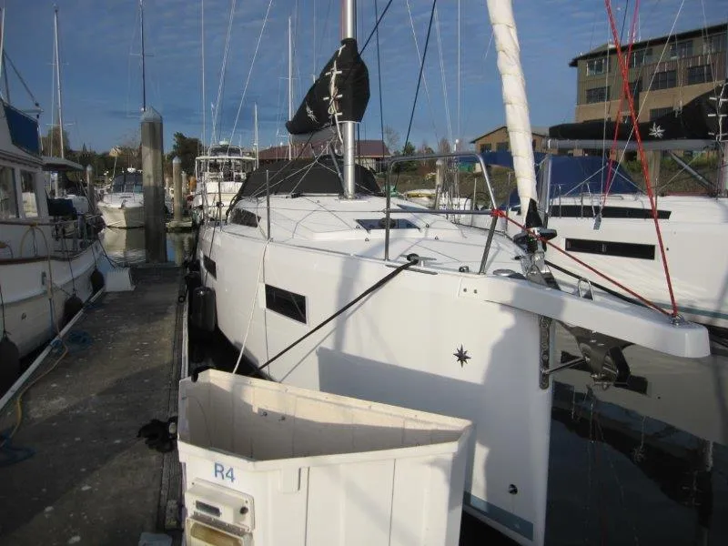 Slide: The Image of 2024 Jeanneau Sun Odyssey 410 sailboat docked at marina. - 41