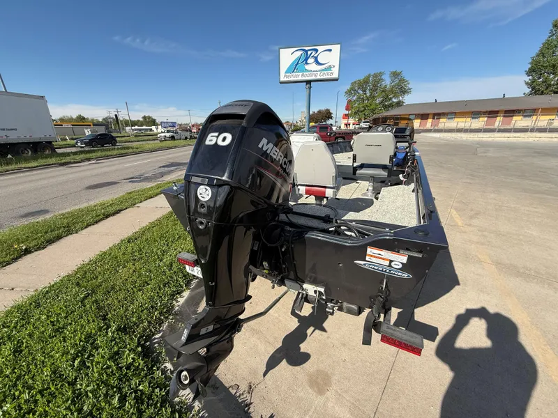 Slide: The Image of 2012 Crestliner Kodiak 16 boat with Mercury 60 outboard motor in parking lot. - 5