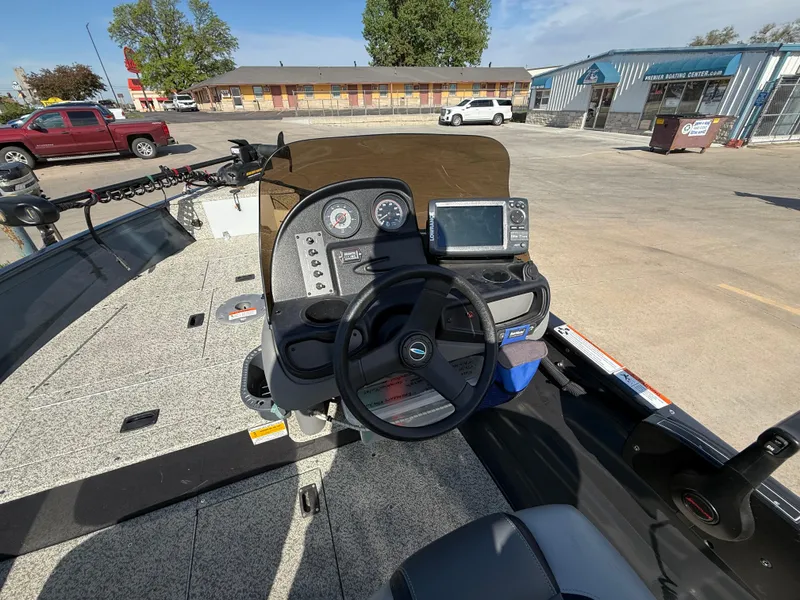 Slide: The Image of Crestliner Kodiak 16 boat dashboard with steering wheel and navigation system, 2012 model. - 6