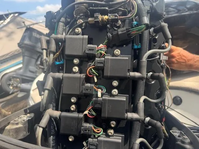 Slide: The Image of 2002 Triton 190-FS boat engine wiring and components close-up. - 18