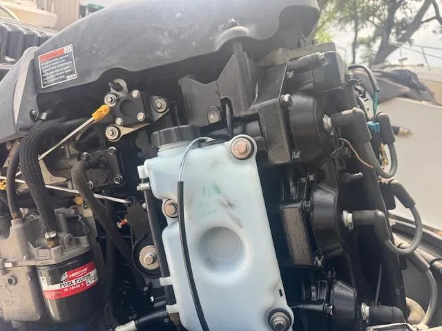 Slide: The Image of Close-up of a 2002 Triton 190-FS boat engine components and wiring. - 20