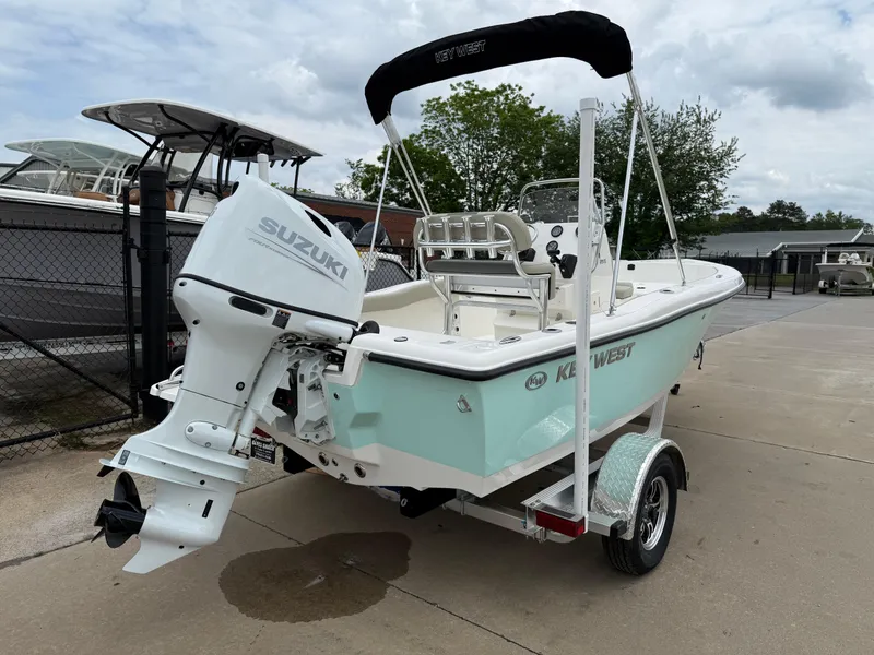 Slide: The Image of 2025 Key West 179 FS boat with Suzuki outboard motor on trailer. - 10