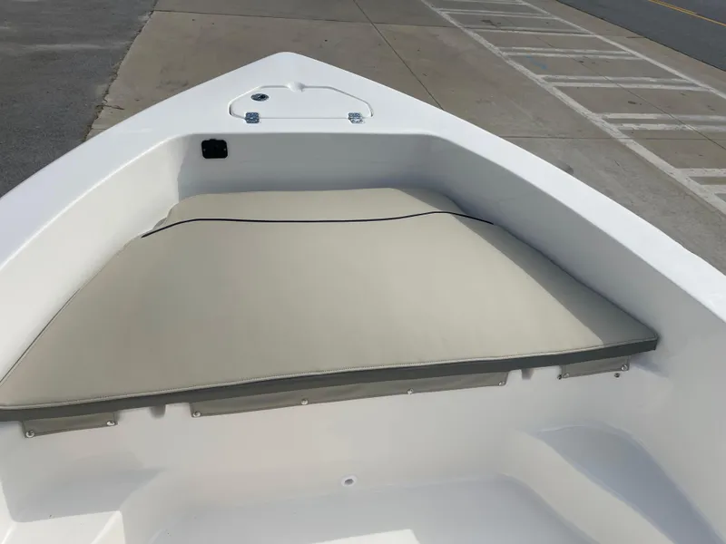 Slide: The Image of 2025 Key West 179 FS boat bow with cushioned seating and storage compartment. - 15