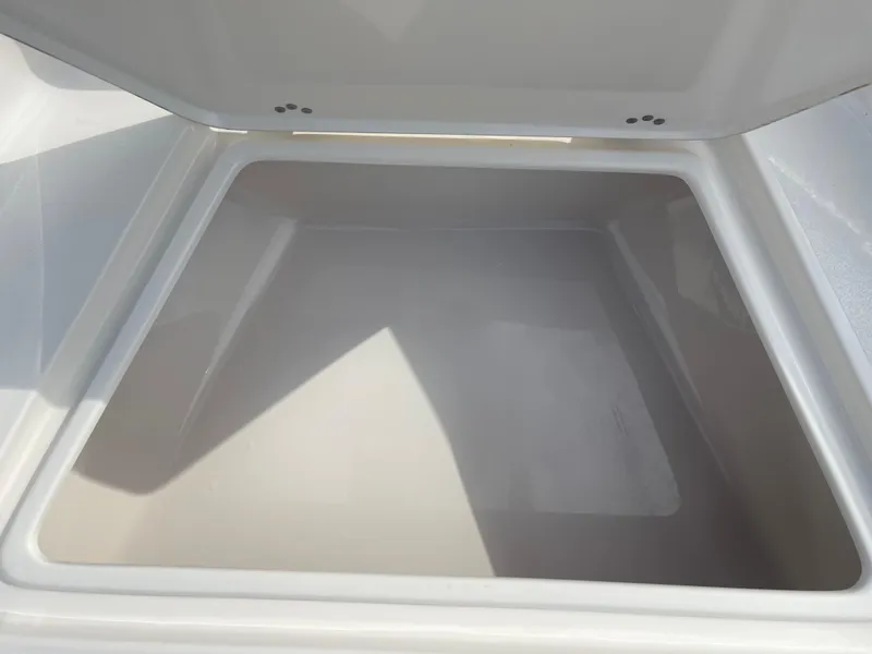 Slide: The Image of Open storage compartment of 2025 Key West 179 FS boat, showcasing spacious interior. - 17