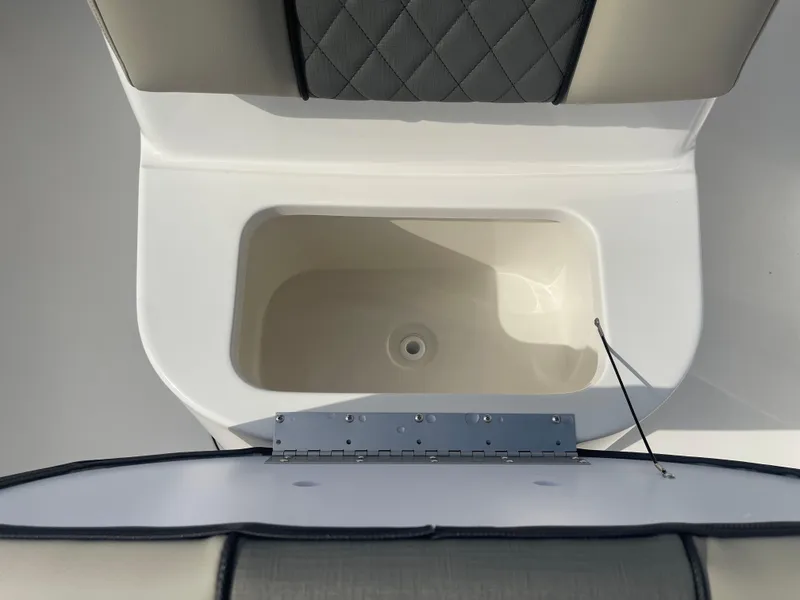 Slide: The Image of 2025 Key West 179 FS boat seat with storage compartment, open view. - 18