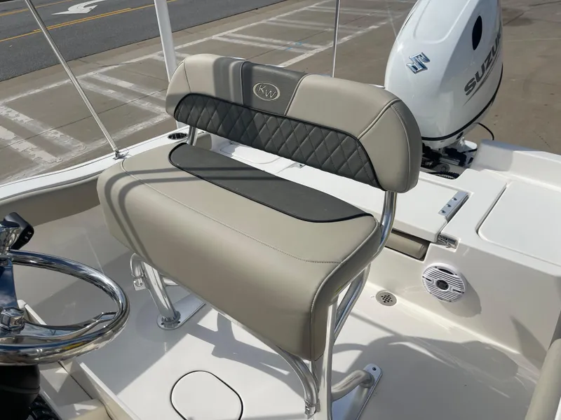 Slide: The Image of 2025 Key West 179 FS boat seat with steering wheel and Suzuki outboard motor. - 19