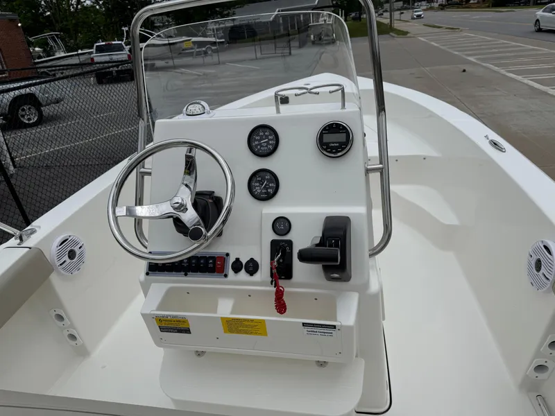 Slide: The Image of 2025 Key West 179 FS boat console with steering wheel and gauges. - 22