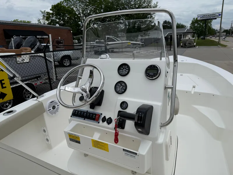 Slide: The Image of 2025 Key West 179 FS boat console with steering wheel and gauges. - 23