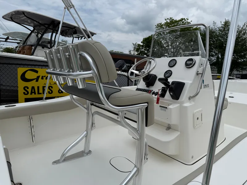 Slide: The Image of 2025 Key West 179 FS boat interior with steering console and seating. - 24