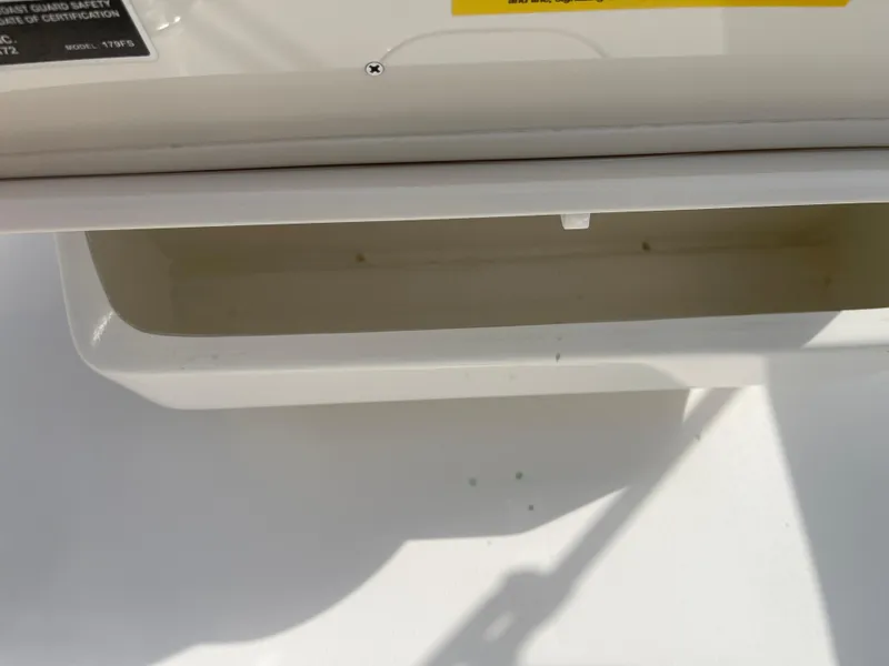 Slide: The Image of Open storage compartment on a 2025 Key West 179 FS boat. - 27
