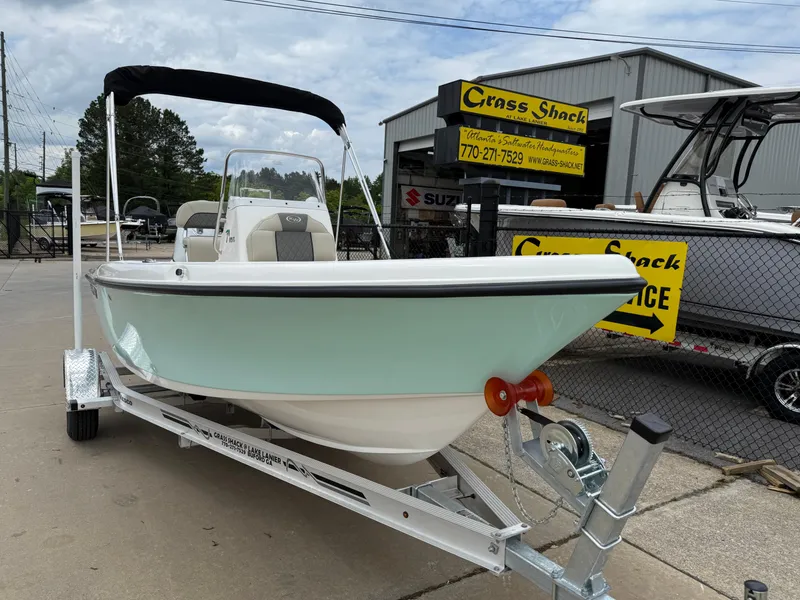Slide: The Image of 2025 Key West 179 FS boat on trailer at dealership, overcast day. - 3