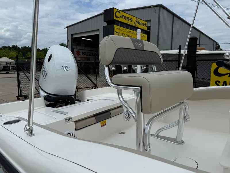 Slide: The Image of 2025 Key West 179 FS boat with Suzuki outboard motor, displayed at a dealership. - 30