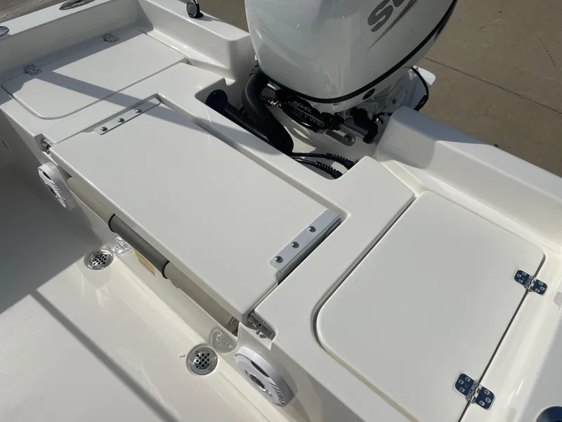 Slide: The Image of 2025 Key West 179 FS boat deck with motor, showcasing sleek design and functionality. - 32