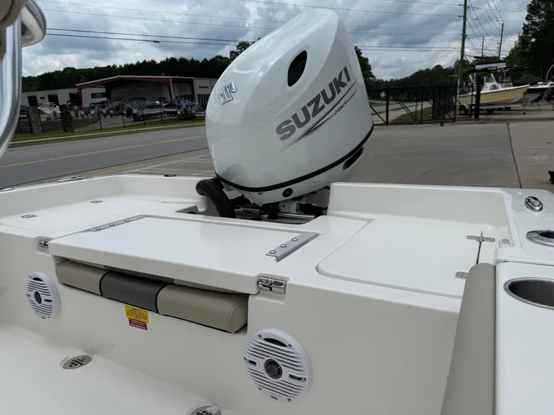 Slide: The Image of 2025 Key West 179 FS boat with Suzuki outboard motor, docked outdoors. - 33