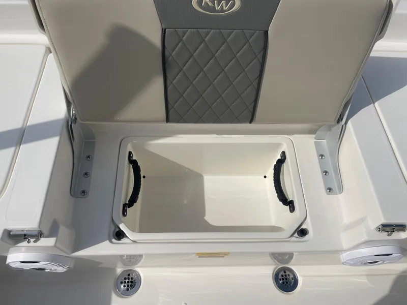Slide: The Image of 2025 Key West 179 FS boat seat with storage compartment, featuring diamond-patterned upholstery. - 35