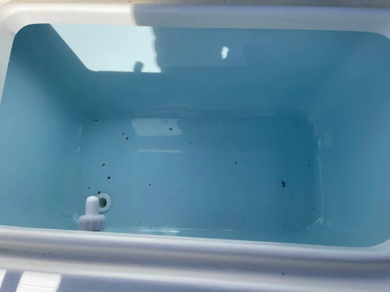 Slide: The Image of Open storage compartment in 2025 Key West 179 FS boat, showing clean interior. - 36