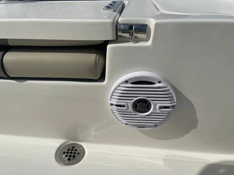 Slide: The Image of 2025 Key West 179 FS boat interior with speaker and cushioned seating. - 42