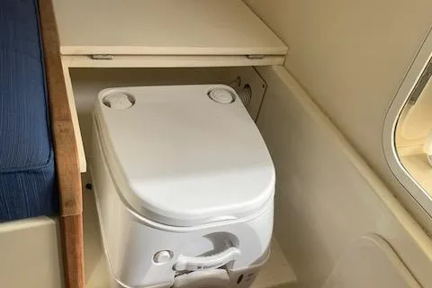 Slide: The Image of Compact marine toilet in 2011 Eastern 24 Explorer boat interior. - 12