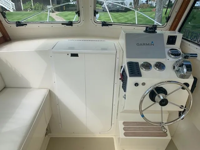 Slide: The Image of Interior helm of 2011 Eastern 24 Explorer boat with Garmin navigation system. - 8