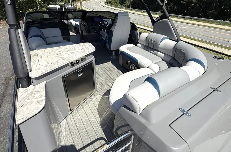 Slide: The Image of 2025 Tahoe Pontoon Grand Tahoe Elite Windshield interior with luxurious seating and modern amenities. - 6