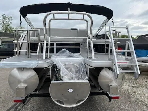 Slide: The Image of 2025 Sweetwater 2286SFL pontoon boat, rear view with dual ladders and canopy. - 3