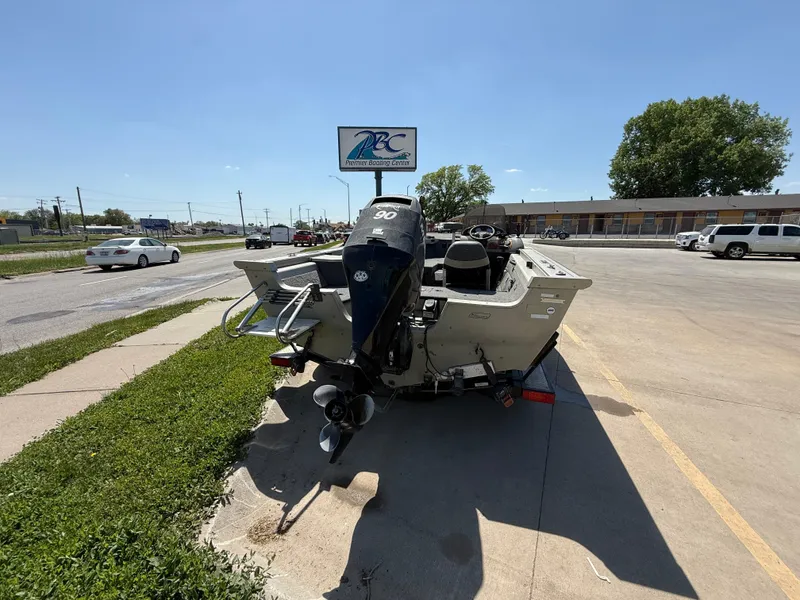Slide: The Image of 2003 Tracker Targa 18 SC boat parked on a sunny street. - 3