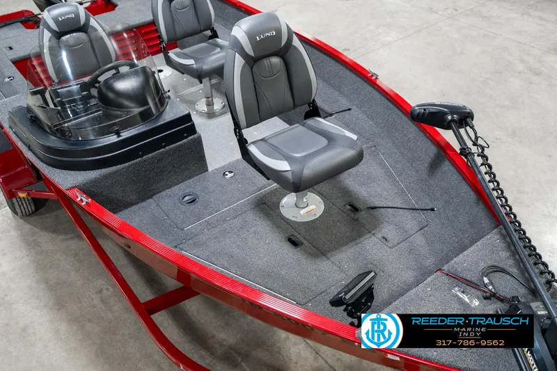 Slide: The Image of 2021 Lund 1650 ANG SS boat with dual seats and red exterior. - 11