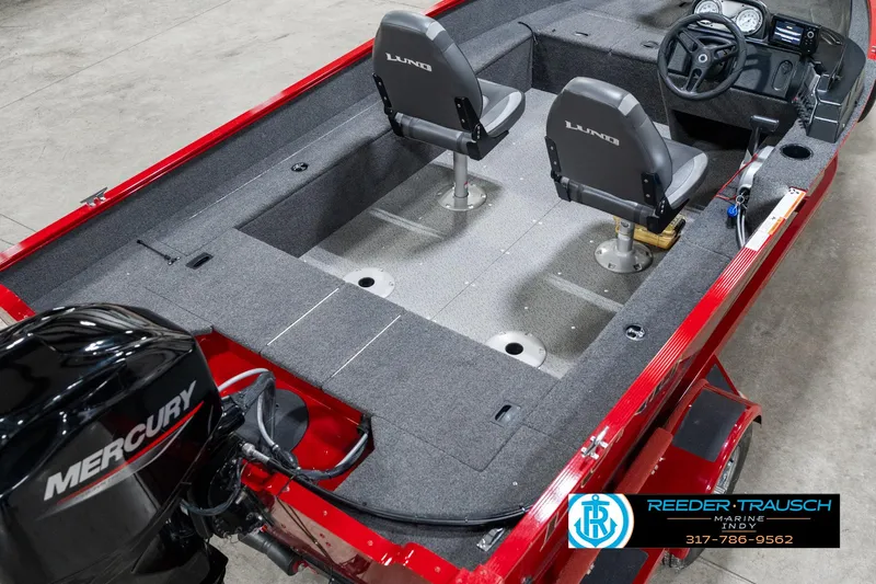 Slide: The Image of 2021 Lund 1650 ANG SS fishing boat interior with Mercury engine, dual seats, and steering console. - 12