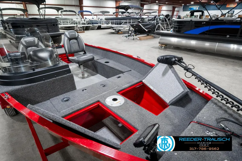 Slide: The Image of 2021 Lund 1650 ANG SS fishing boat interior with seating and storage compartments. - 20