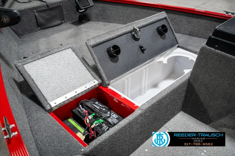 Slide: The Image of 2021 Lund 1650 ANG SS boat interior with storage compartments and battery. - 22